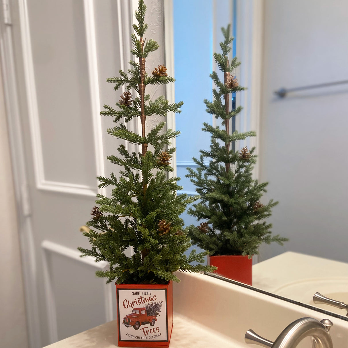 24 Inch Potted Tree with Pinecones, Metal Pot with Classic Red Truck