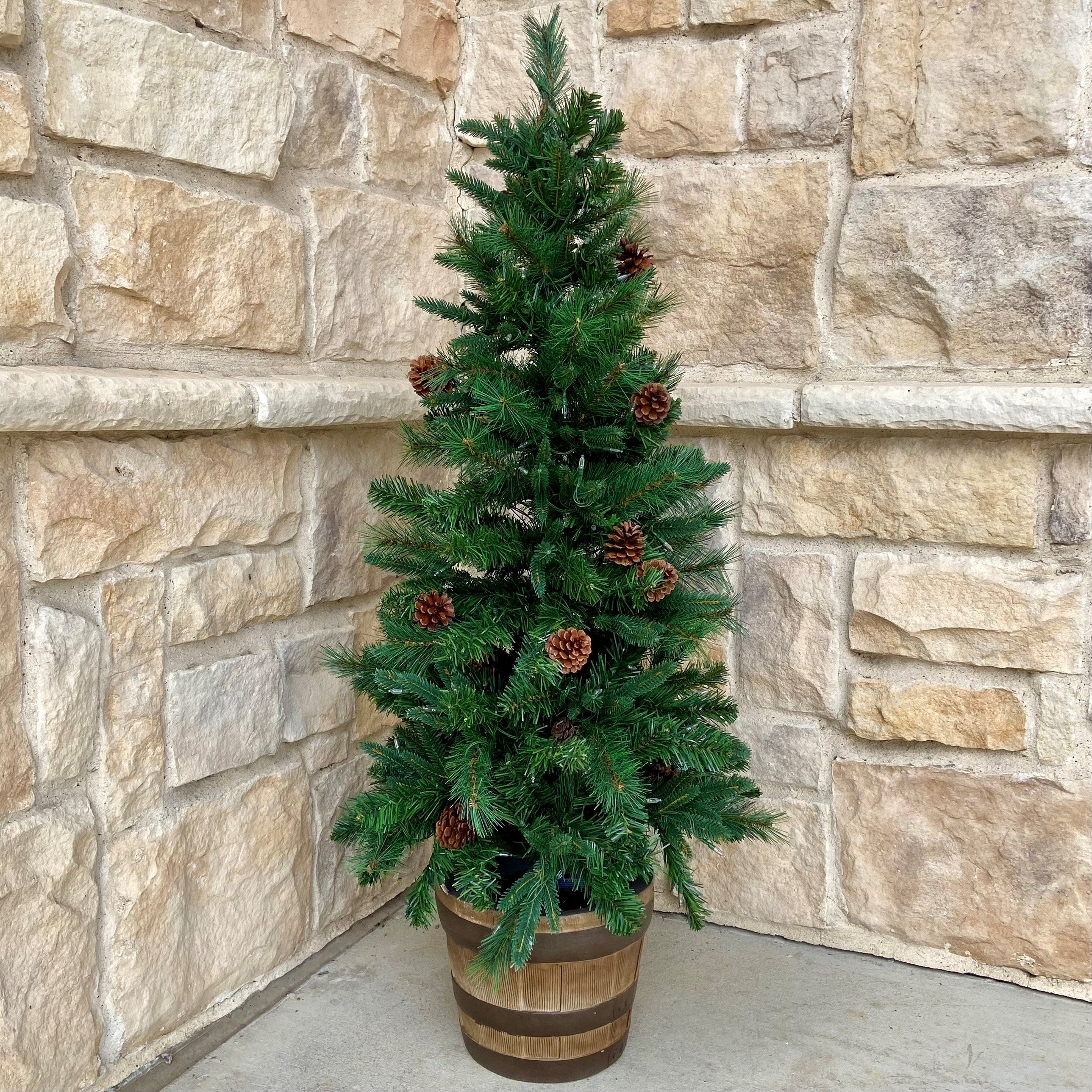 christmas tree pot plant Haute Decor 4 Ft. Tall Whiskey Barrel Potted Christmas Tree with Soft White T5 LED Lights