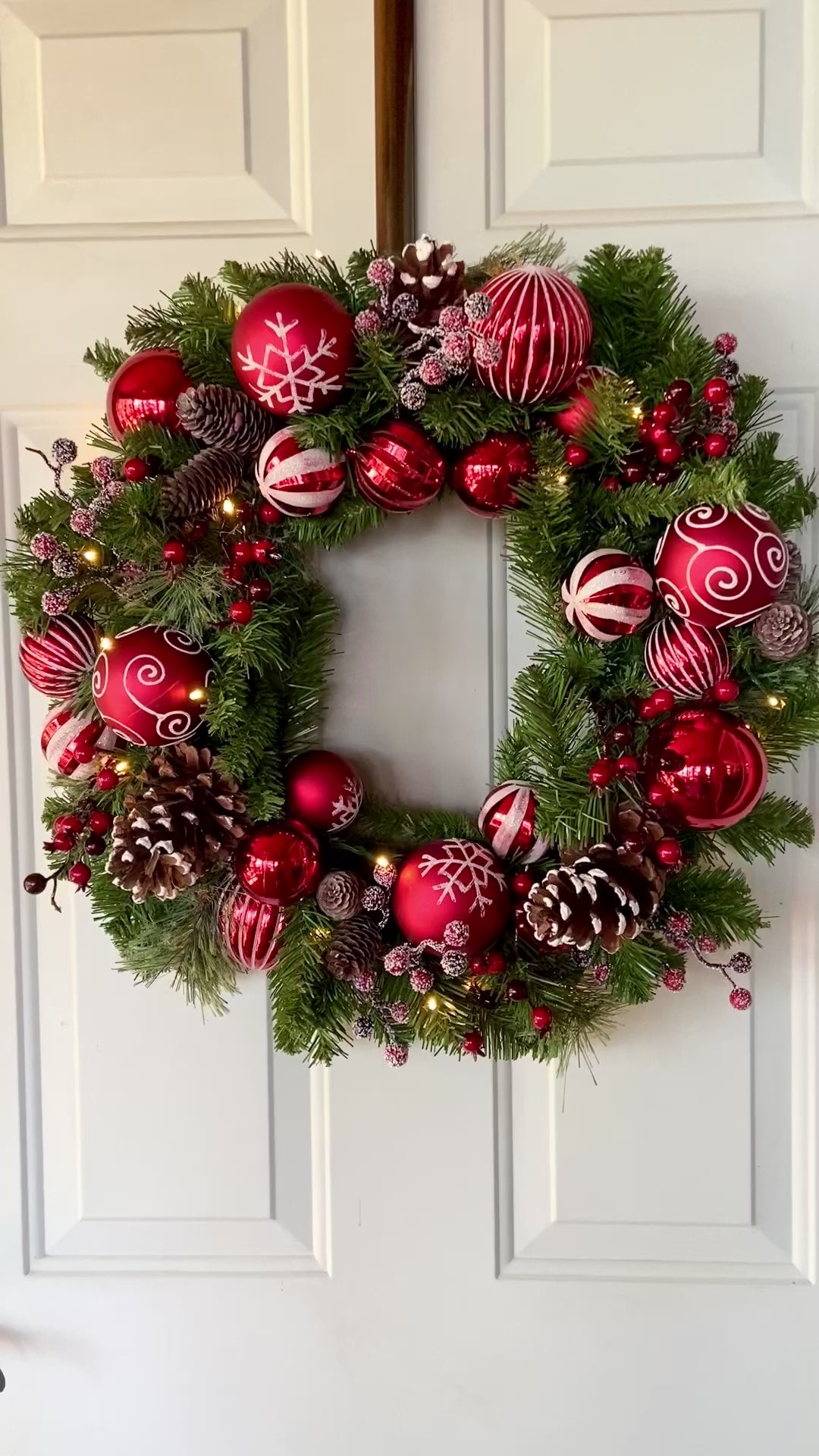 Haute Decor 26 Inch Holiday Times Wreath with Patterned Red and White Shatterproof Ornaments, Berries, and Real Pinecones