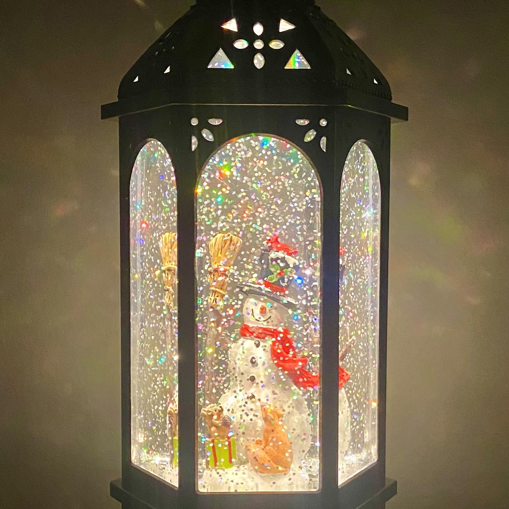 Snowburst Lantern With Snowman And Glittering Light Snow Show Haute snowburst-lantern-with-snowman-and-glittering-light-snow-show-haute
